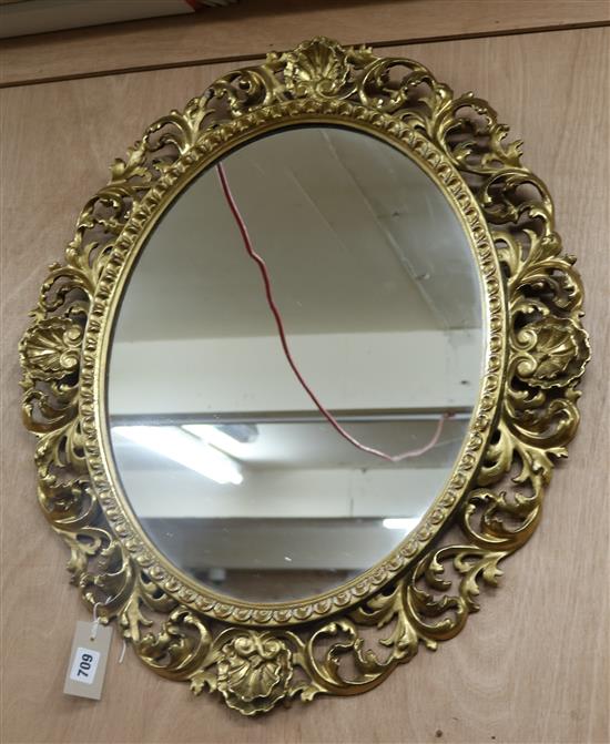 A 19th century Florentine oval carved gilt-framed mirror H.66cm